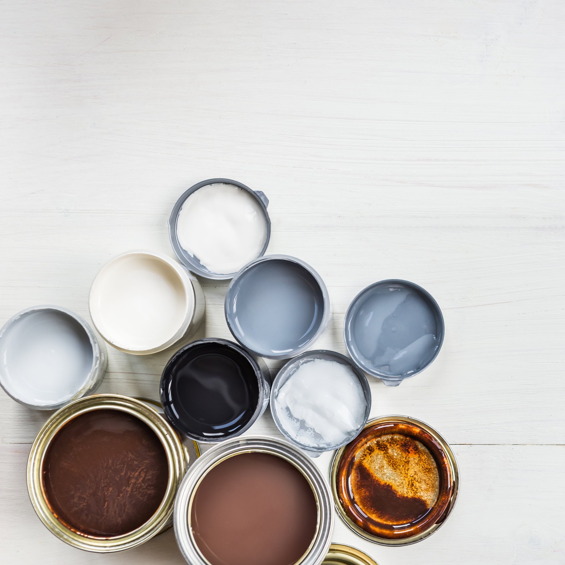 Open Cans of Different Paints, Varnish and Stain